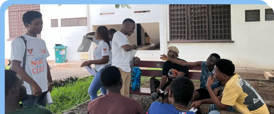Three people walking together with a bottle of water in the hand of one